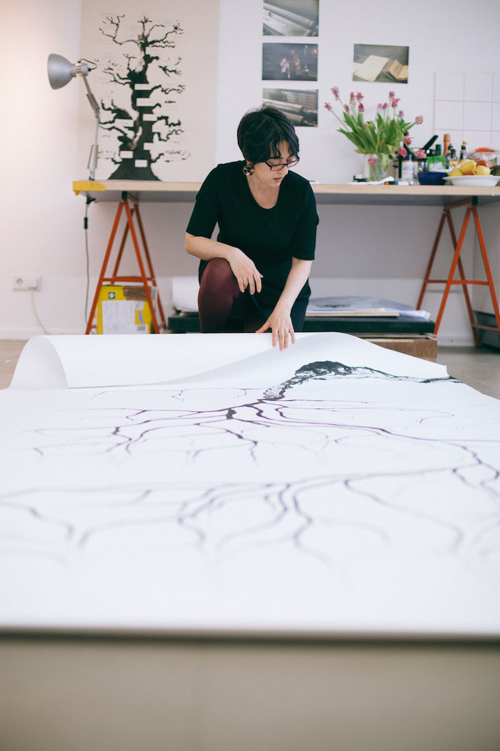 The artist showing us her ink drawings for the coming exhibition "Written in the Margins", photo by Kathrin Leisch